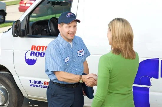 Gas Line Repair Plumbing Technician Shaking Hand With Lady
