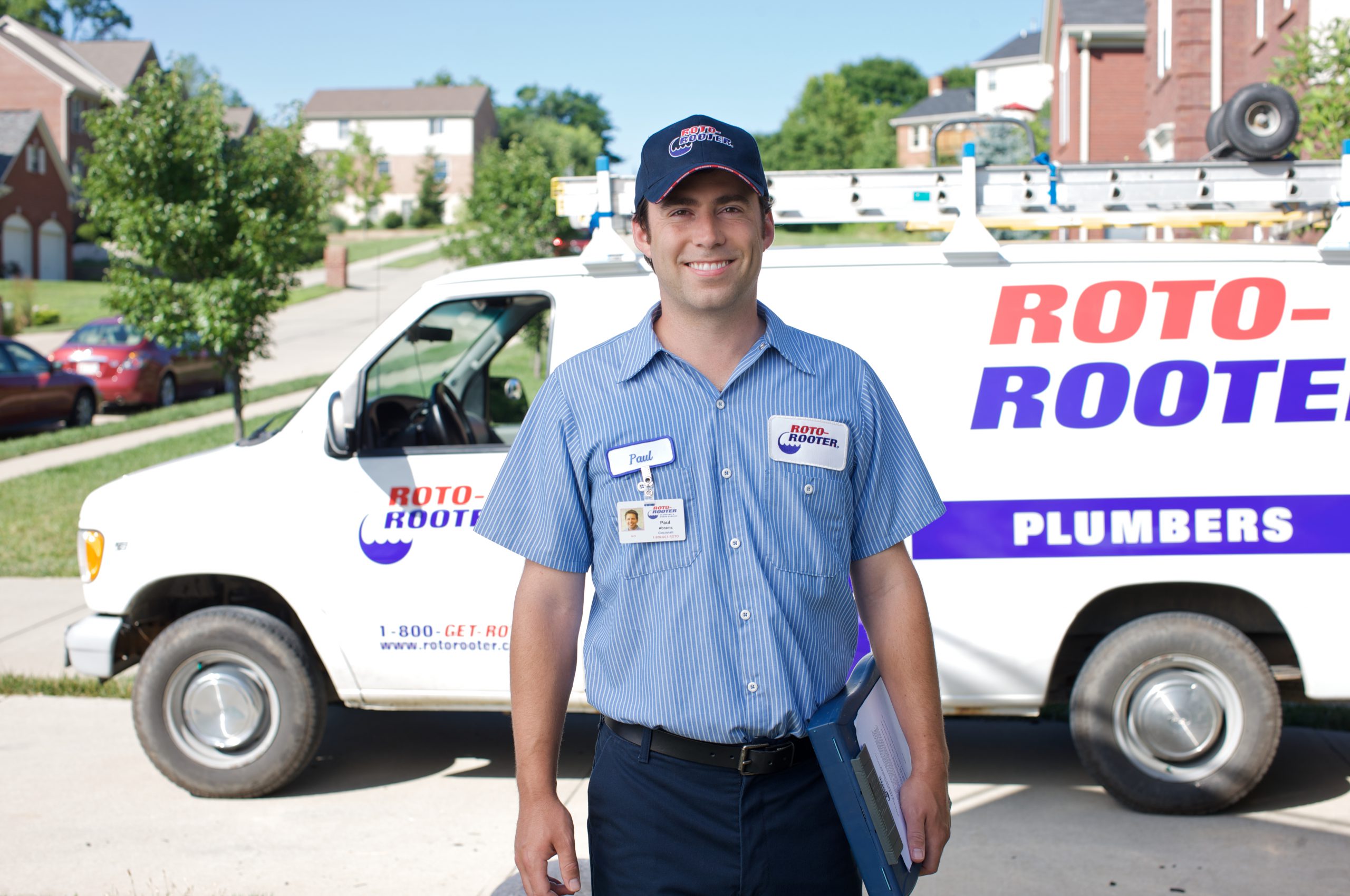 24 Hour Emergency Plumber - Man In Plumbing Unifrom With Documents