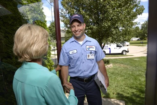 Garbage Disposal Replacement and Repair Plumbing Technician Shaking Hand With Lady - Garbage Disposal Replacement