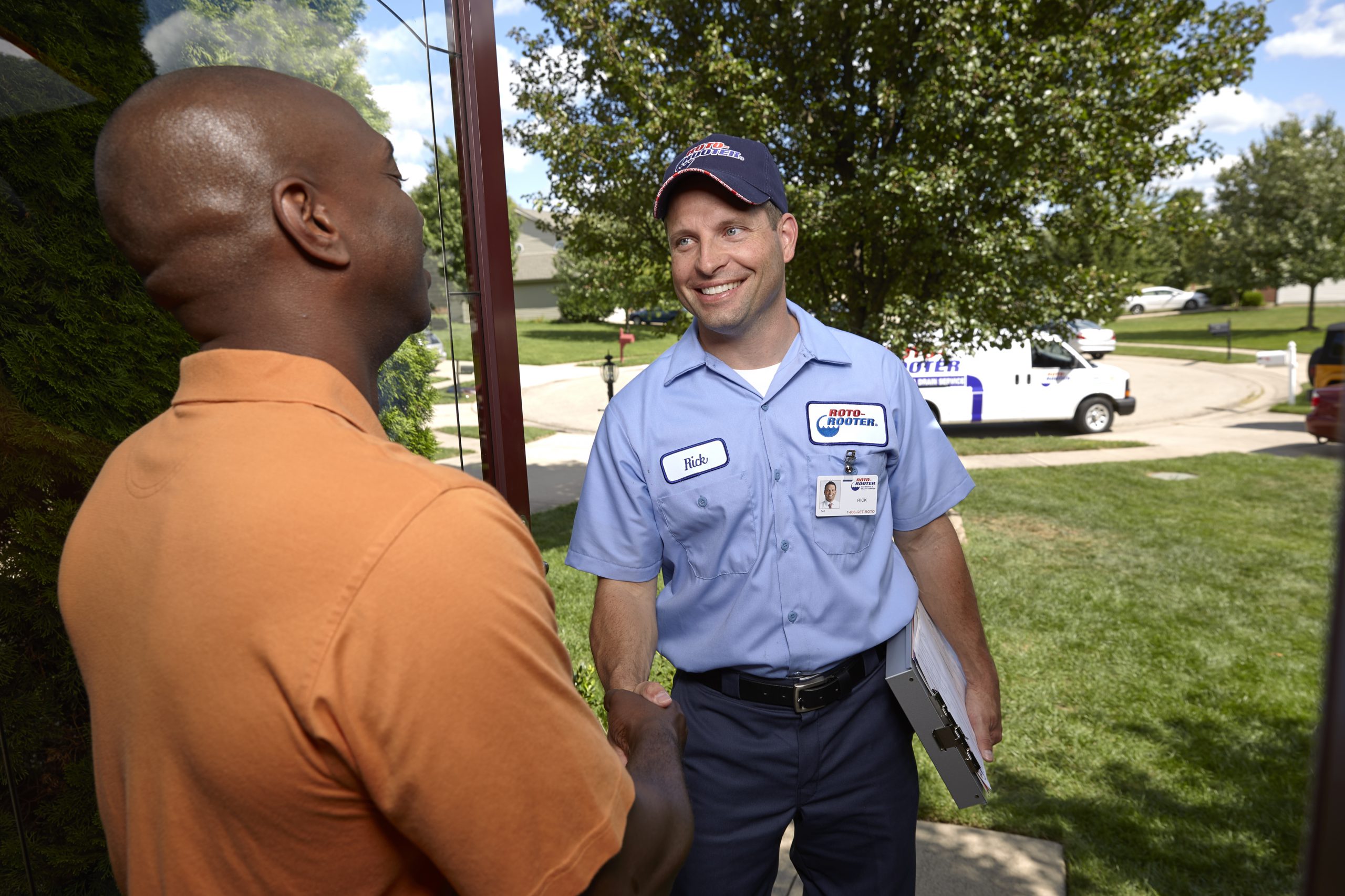Pipe Leak Repair - Plumbing Technician Shaking Hand With Man
