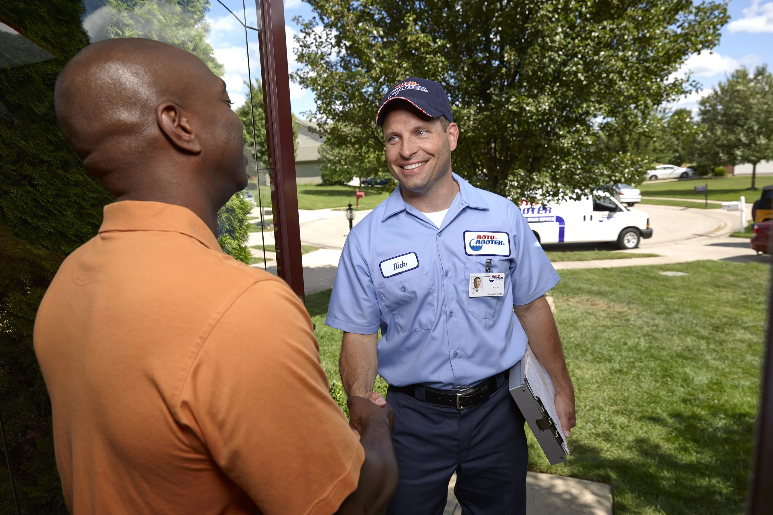 Pipe Leak Repair - Plumbing Technician Shaking Hand With Man